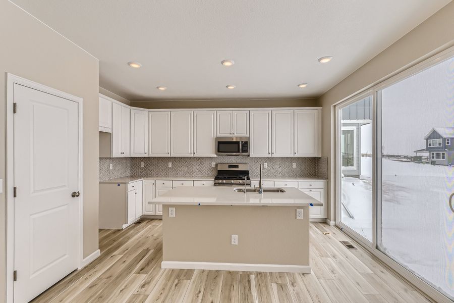 Furnished interior view inside a new home in The Aurora Highlands, Aurora (Image 5).