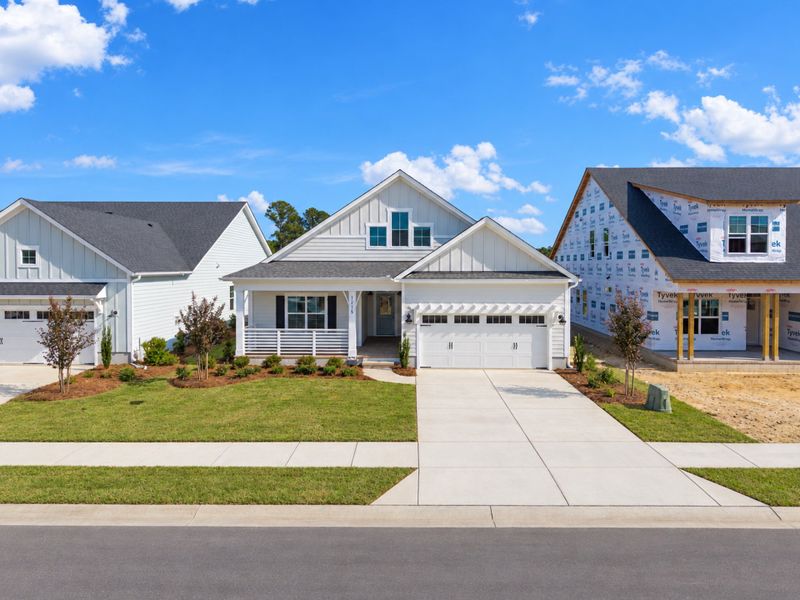 Front exterior of a new home in Sidbury Landing, Wilmington, NC, highlighting curb appeal (Image 20).