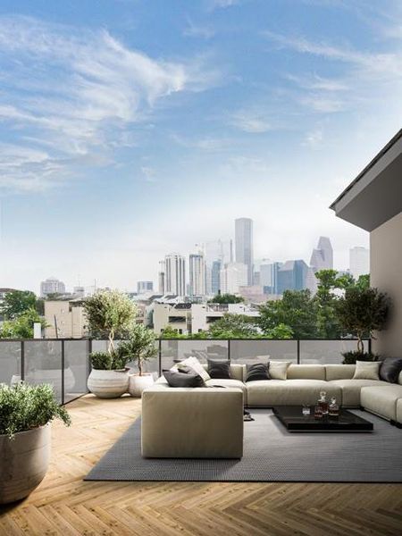 This photo showcases a modern rooftop terrace with a spacious seating area and lush planters. The space offers stunning downtown views of a Houston skyline under a clear blue sky, perfect for relaxation and entertaining. Virtually Staged.