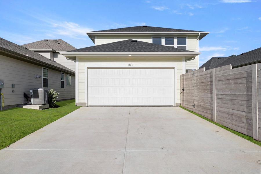 Front exterior of a new home in Carriage Collection at Painted Tree, McKinney, TX, highlighting curb appeal (Image 18).