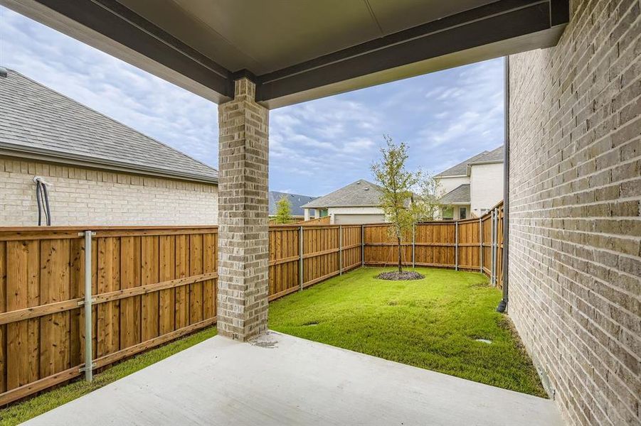 Fenced backyard featuring a patio Fenced backyard featuring a patio