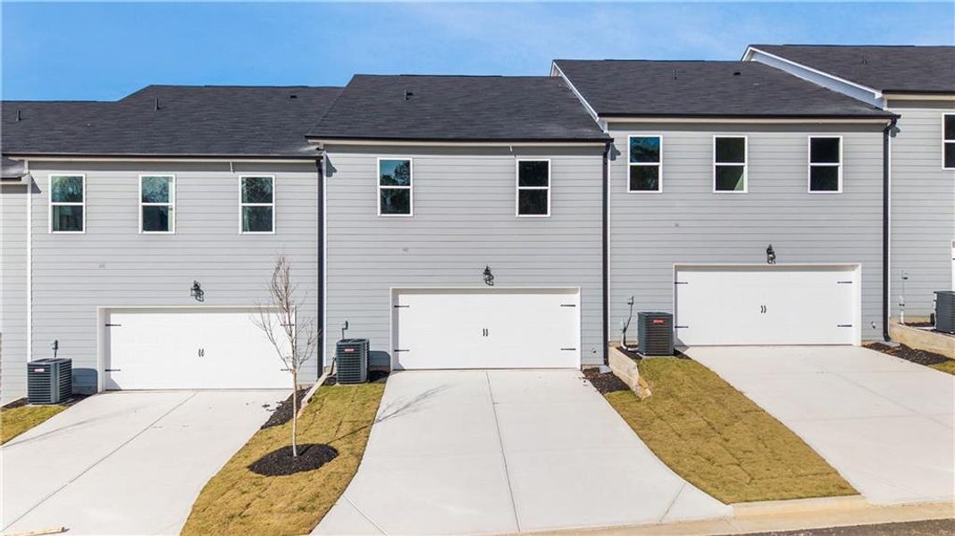 Front exterior of a new home in , Conyers, GA, highlighting curb appeal (Image 15).