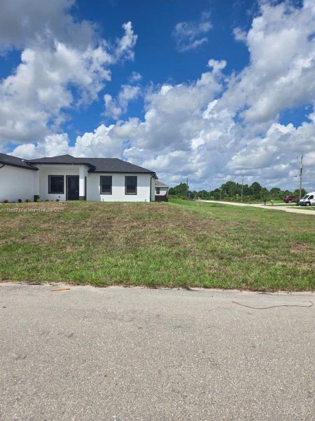 Front exterior of a new home in , Lehigh Acres, FL, highlighting curb appeal (Image 18). Front exterior of a new home in , Lehigh Acres, FL, highlighting curb appeal (Image 18).
