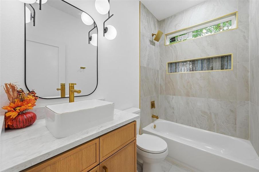 Full bathroom featuring tub / shower combination and vanity Full bathroom featuring tub / shower combination and vanity