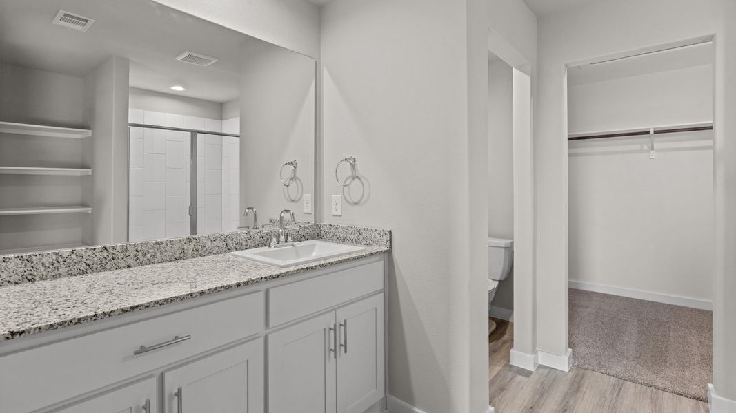 Representative furnished interior of a home built from the JUSTIN by D.R. Horton in Homestead at Parks Bell Ranch, Odessa (Image 15).