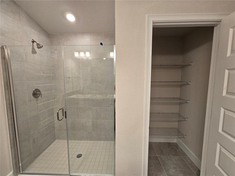 main bath with tiled shower and linen close main bath with tiled shower and linen close