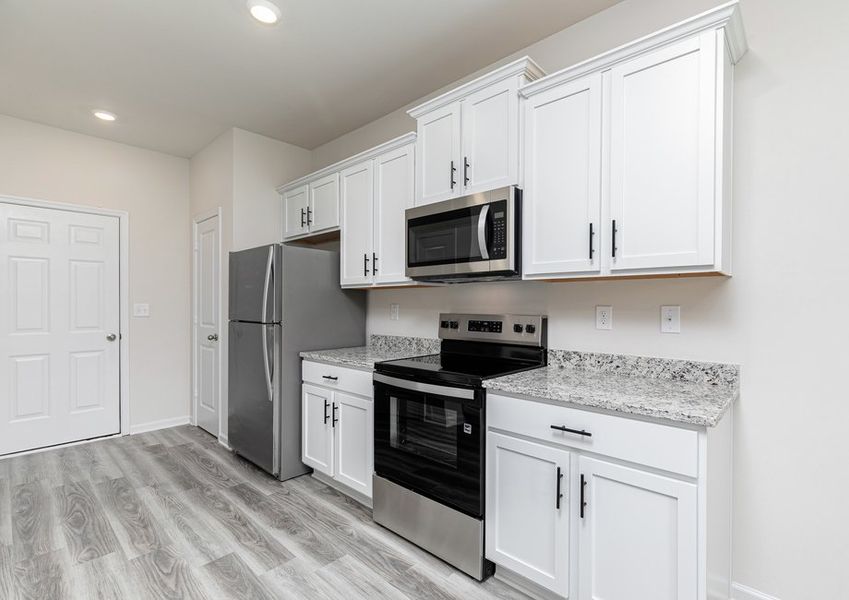 Each kitchen includes stainless steel appliances