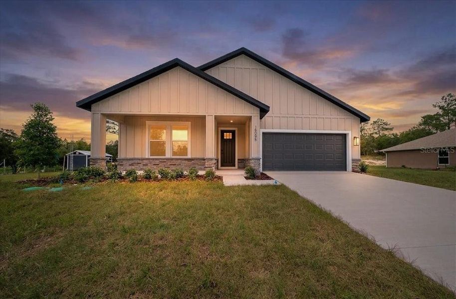 Front exterior of a new home in , Weeki Wachee, FL, highlighting curb appeal (Image 28).