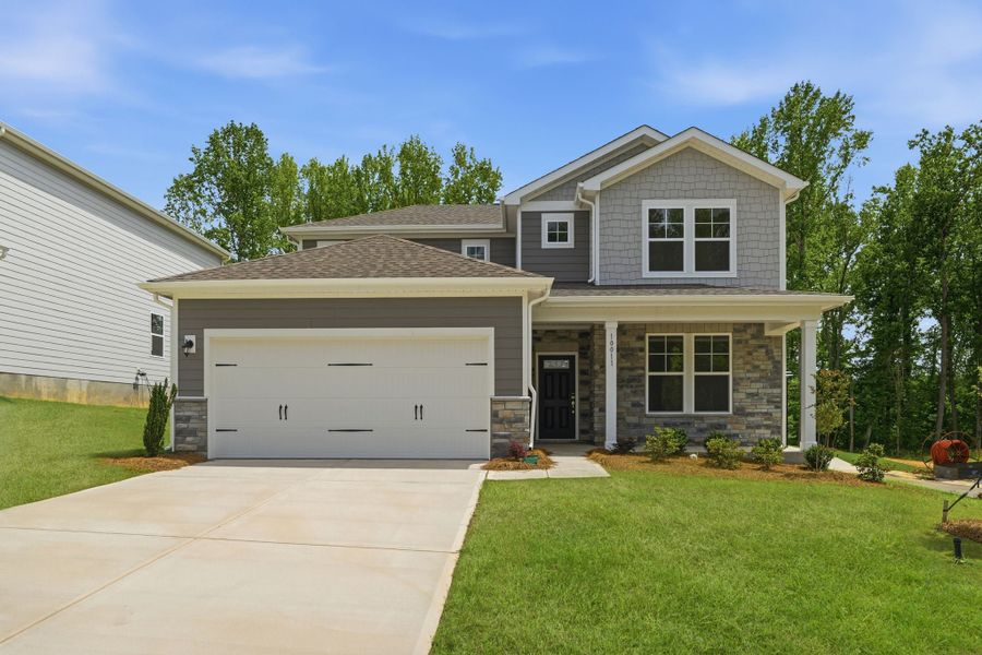 Front exterior of a new home in Cannon Manor, Kannapolis, NC, highlighting curb appeal (Image 1). Front exterior of a new home in Cannon Manor, Kannapolis, NC, highlighting curb appeal (Image 1).