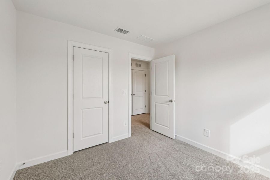 Spacious, unfurnished interior of a new home in Meadows at Wilson Farms - The Heights Series, Fort Mill (Image 25). Spacious, unfurnished interior of a new home in Meadows at Wilson Farms - The Heights Series, Fort Mill (Image 25).