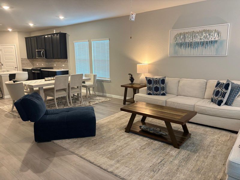 An inviting open-concept living area with integrated kitchen and dining, creating a harmonious flow.