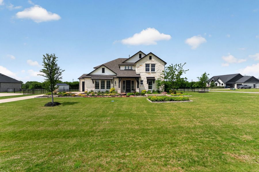 Front exterior of a new home in Highland Crossing, Celina, TX, highlighting curb appeal (Image 22).