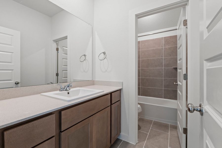 Bathroom in the Pearl home plan by Trophy Signature Homes – REPRESENTATIVE PHOTO