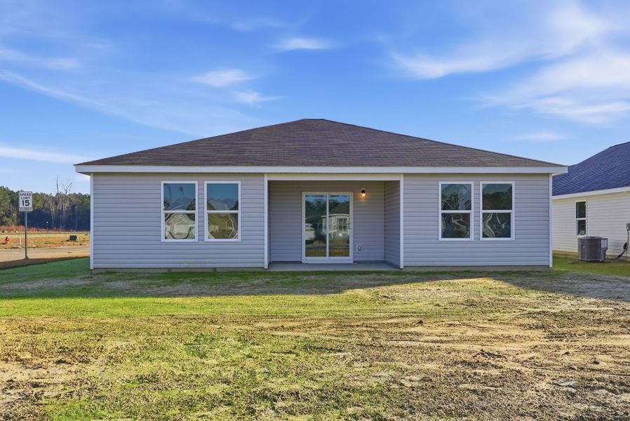 A house with a grass yard.