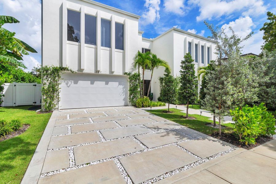 Front exterior of a new home in , West Palm Beach, FL, highlighting curb appeal (Image 2). Front exterior of a new home in , West Palm Beach, FL, highlighting curb appeal (Image 2).