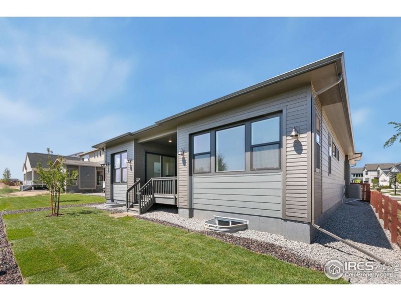 Front exterior of a new home in Festival at RainDance, Windsor, CO, highlighting curb appeal (Image 2).