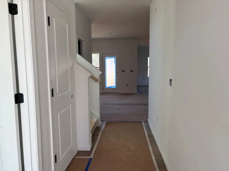 Foyer featuring the AW Collection® Rosemary - Natural light and bold color create grounded warmth. Foyer featuring the AW Collection® Rosemary - Natural light and bold color create grounded warmth.