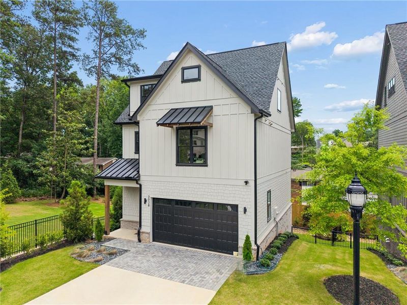 Front exterior of a new home in , Smyrna, GA, highlighting curb appeal (Image 25). Front exterior of a new home in , Smyrna, GA, highlighting curb appeal (Image 25).