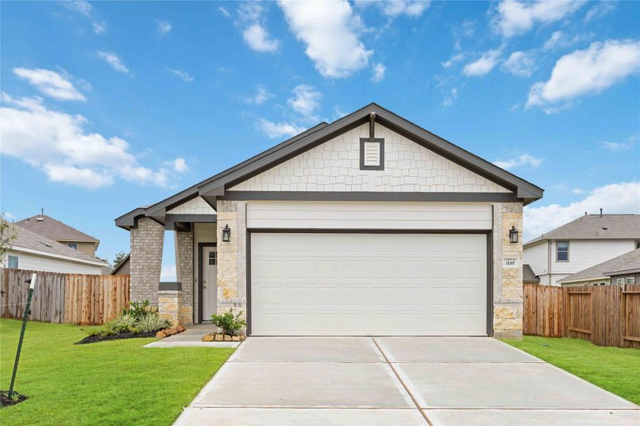 Front exterior of a new home in Meadow Park, Conroe, TX, highlighting curb appeal (Image 1).