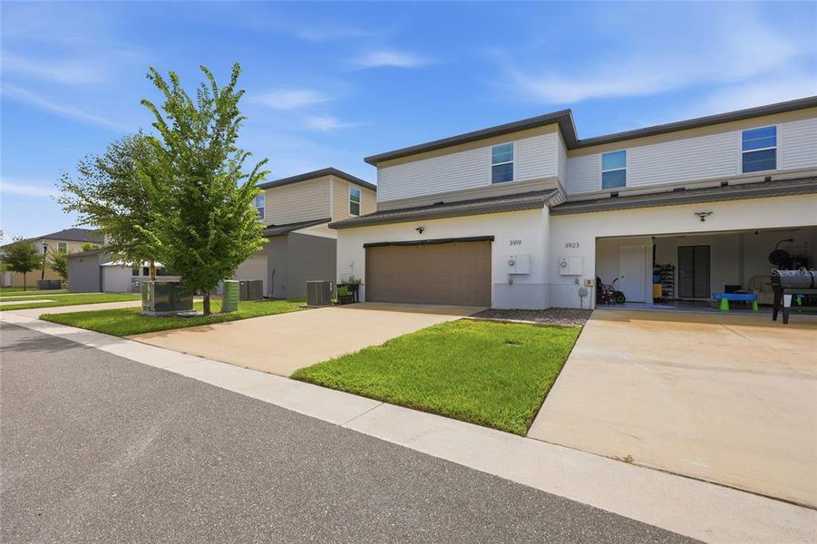 Front exterior of a new home in , St. Cloud, FL, highlighting curb appeal (Image 24).