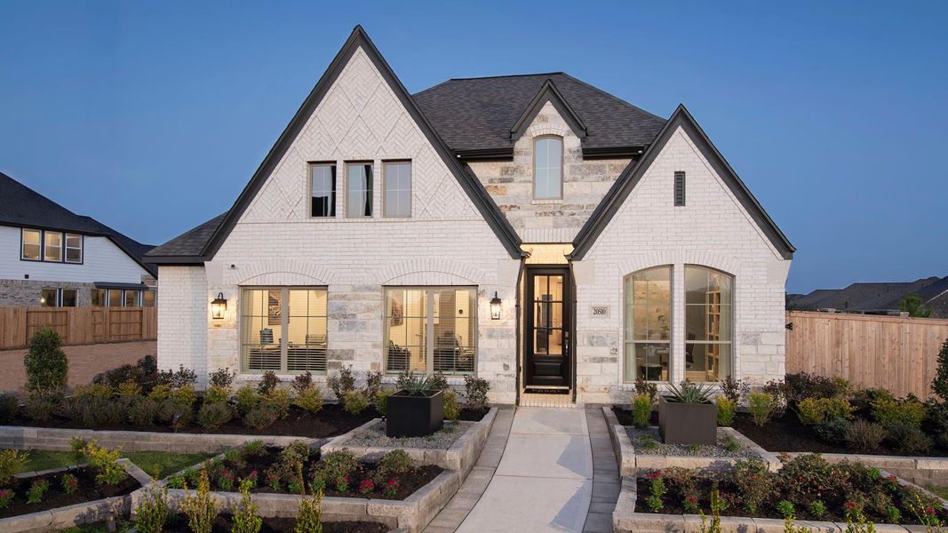 Front exterior of a new home in Amira, Tomball, TX, highlighting curb appeal (Image 2).