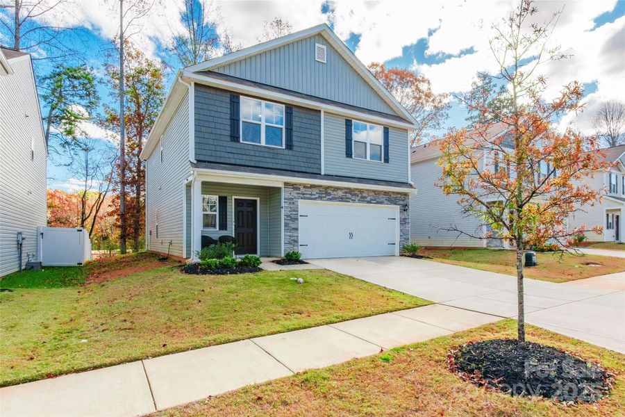 Front exterior of a new home in McGee Place, Charlotte, NC, highlighting curb appeal (Image 2).