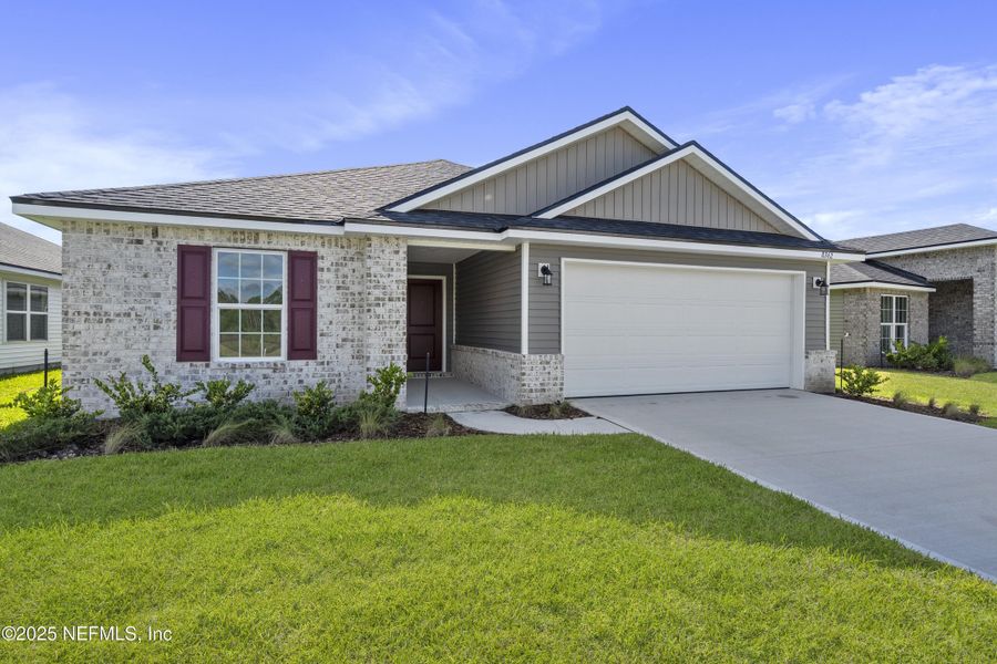 Front exterior of a new home in Summerglen, Jacksonville, FL, highlighting curb appeal (Image 16).