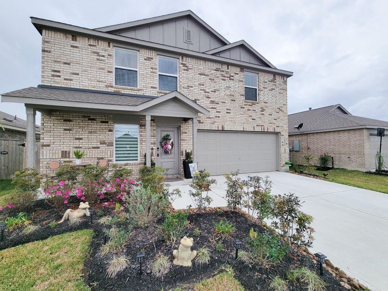 Front exterior of a new home in Tavola, New Caney, TX, highlighting curb appeal (Image 22).