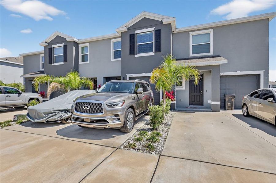Front exterior of a new home in , Wimauma, FL, highlighting curb appeal (Image 22). Front exterior of a new home in , Wimauma, FL, highlighting curb appeal (Image 22).