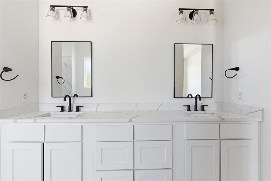 Bathroom featuring double vanity Bathroom featuring double vanity