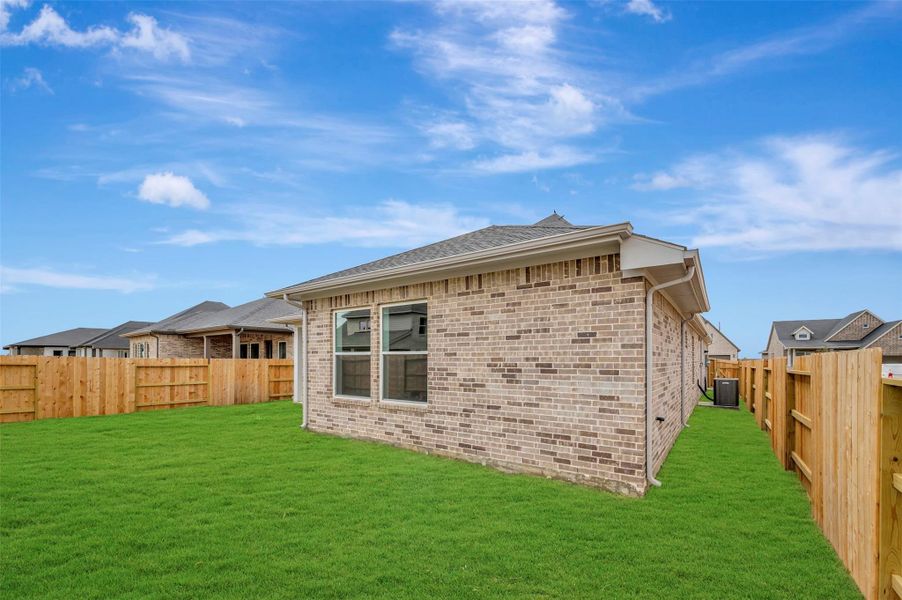 Exterior details and patio area of a home in The Grand Prairie - Retreat Collection, Hockley (Image 27).