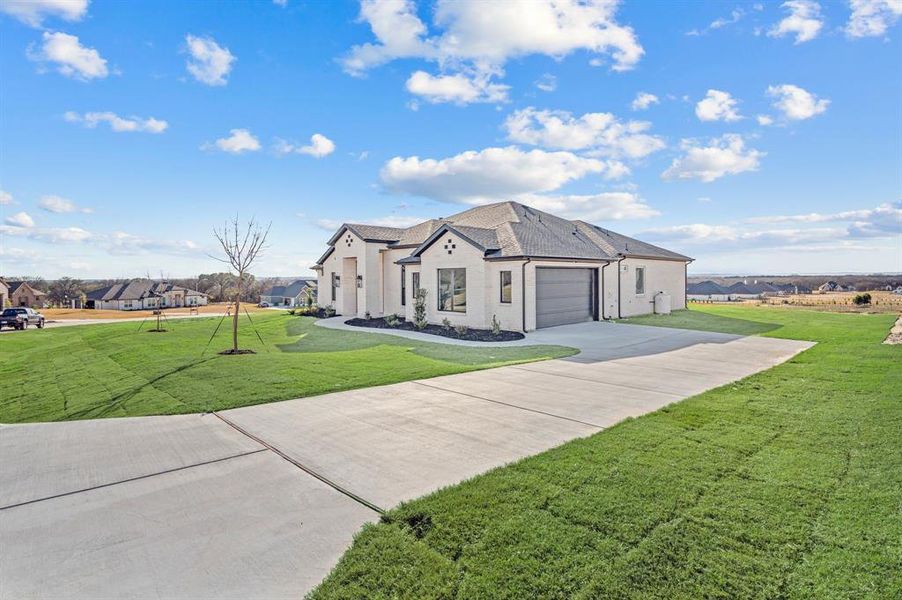 Front exterior of a new home in Rocky Top Ranch, Reno, TX, highlighting curb appeal (Image 22).