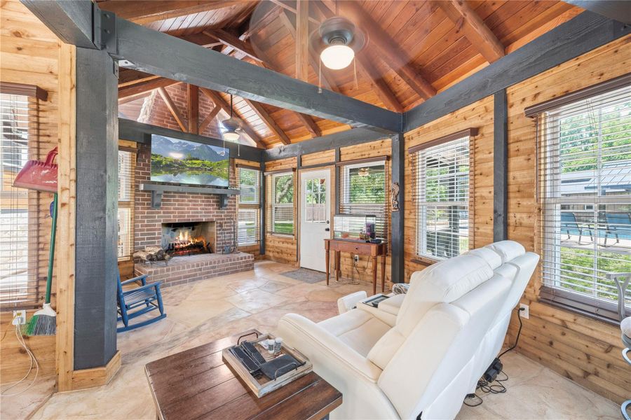 Rustic men’s retreat showcasing soaring timber ceilings, a statement fireplace, and lodge-inspired ambiance.