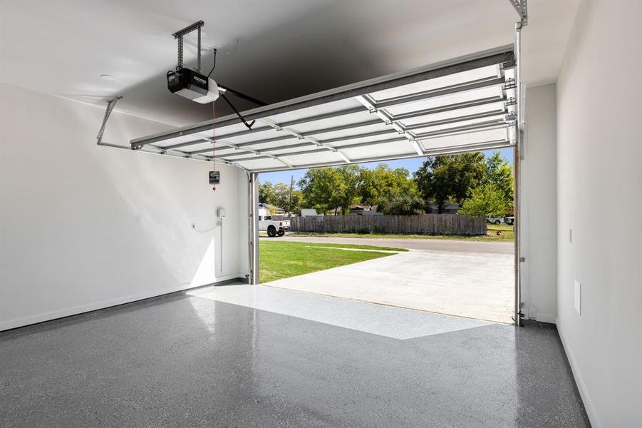 Two car garage with epoxy flooring and automatic door