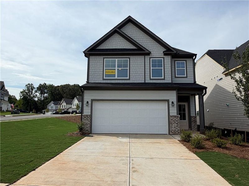 Front exterior of a new home in Villas at Dawsonville, Dawsonville, GA, highlighting curb appeal (Image 1). Front exterior of a new home in Villas at Dawsonville, Dawsonville, GA, highlighting curb appeal (Image 1).