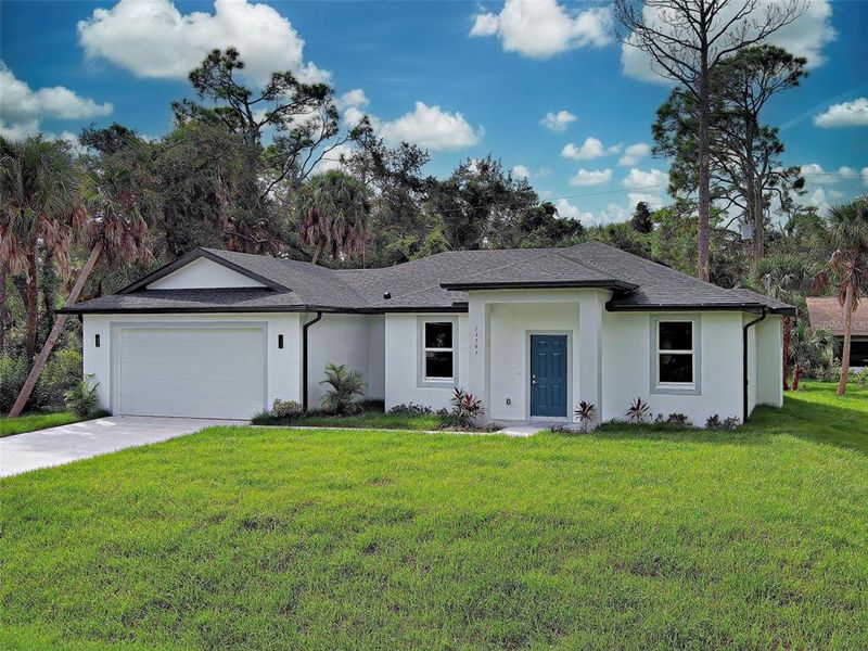 Front exterior of a new home in , Port Charlotte, FL, highlighting curb appeal (Image 25).