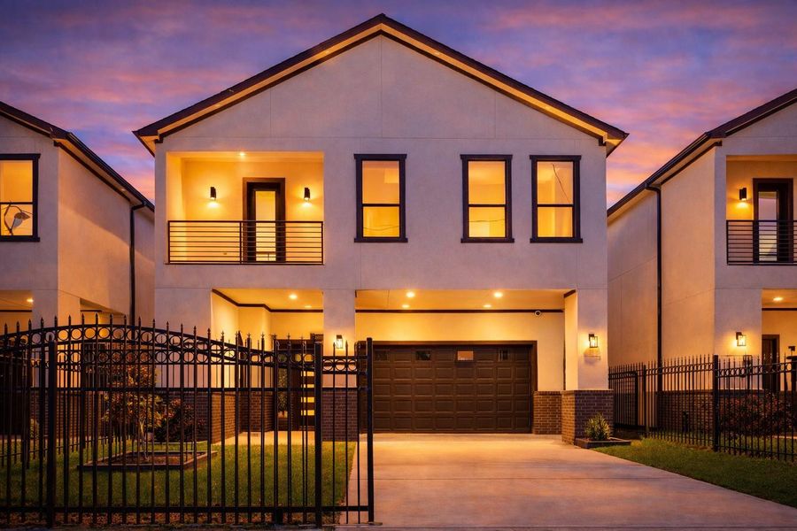 Modern design defines this gated residence, with a streamlined façade and crisp architectural lines. A private driveway and attached garage add ease and seclusion, while the second-level balcony and tall windows fill the interiors with natural light. Modern design defines this gated residence, with a streamlined façade and crisp architectural lines. A private driveway and attached garage add ease and seclusion, while the second-level balcony and tall windows fill the interiors with natural light.