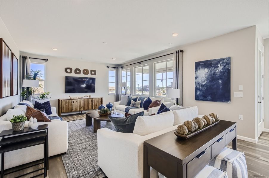 A living room with a large window. A living room with a large window.