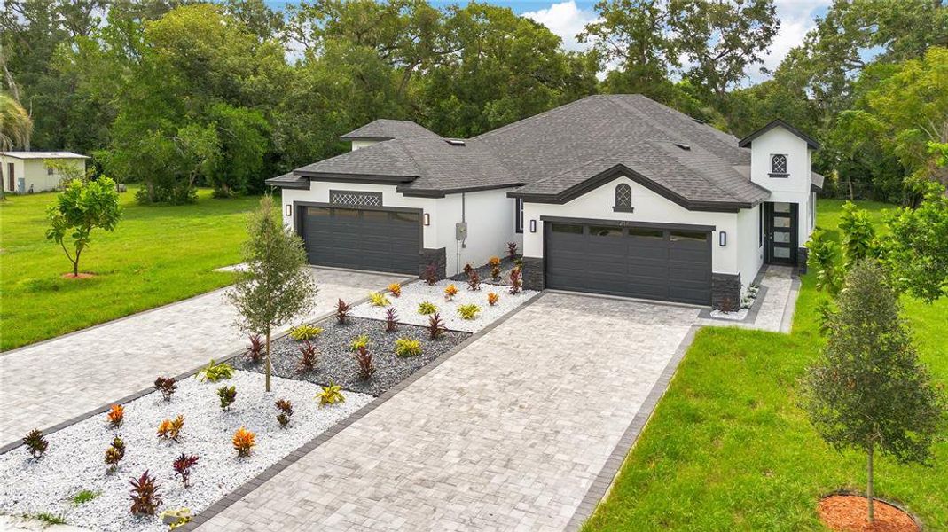 Front exterior of a new home in , Apopka, FL, highlighting curb appeal (Image 28).