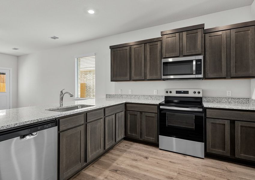 The kitchen has a wonderful breakfast bar.
