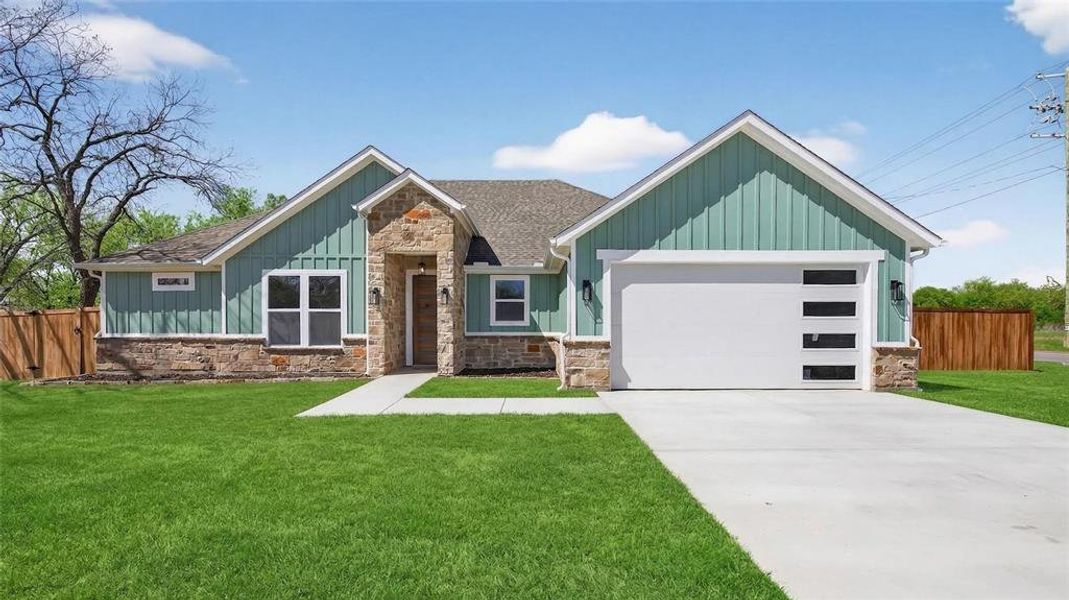 Front exterior of a new home in , Mansfield, TX, highlighting curb appeal (Image 1). Front exterior of a new home in , Mansfield, TX, highlighting curb appeal (Image 1).