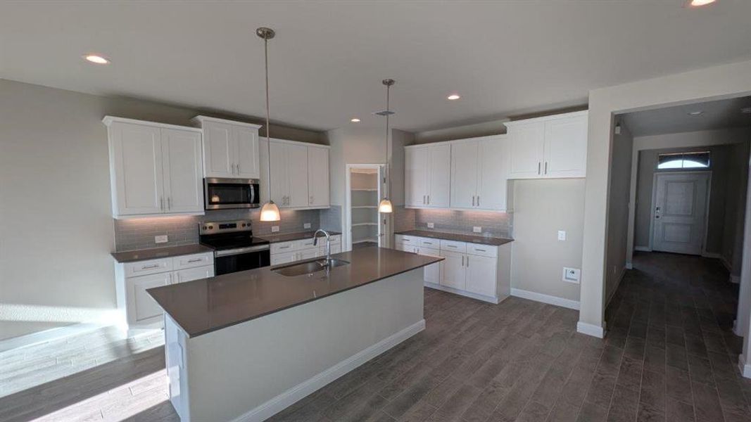 Kitchen - All Home and community information, including pricing, included features, terms, availability and amenities, are subject to change at any time without notice or obligation. All Drawings, pictures, photographs, video, square footages, floor plans, elevations, features, colors and sizes are approximate for illustration purposes only and will vary from the homes as built. Kitchen - All Home and community information, including pricing, included features, terms, availability and amenities, are subject to change at any time without notice or obligation. All Drawings, pictures, photographs, video, square footages, floor plans, elevations, features, colors and sizes are approximate for illustration purposes only and will vary from the homes as built.