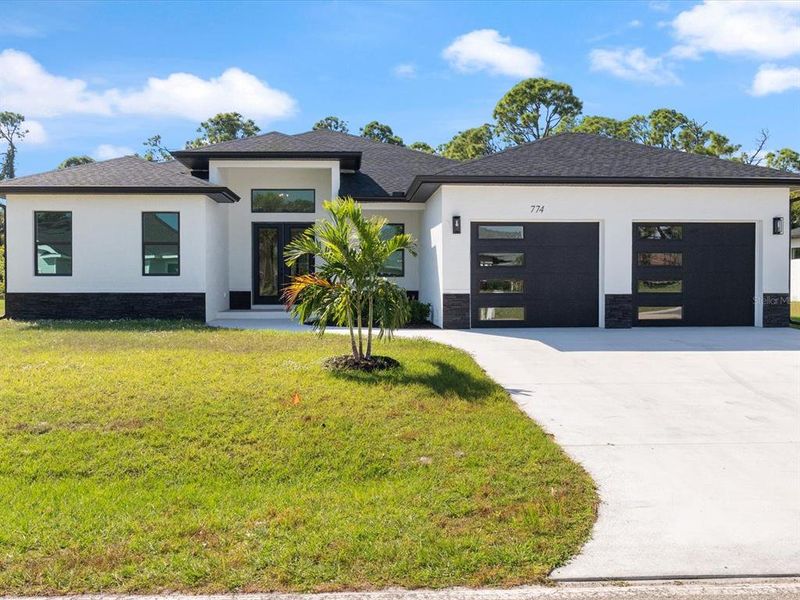Front exterior of a new home in , Rotonda West, FL, highlighting curb appeal (Image 1). Front exterior of a new home in , Rotonda West, FL, highlighting curb appeal (Image 1).