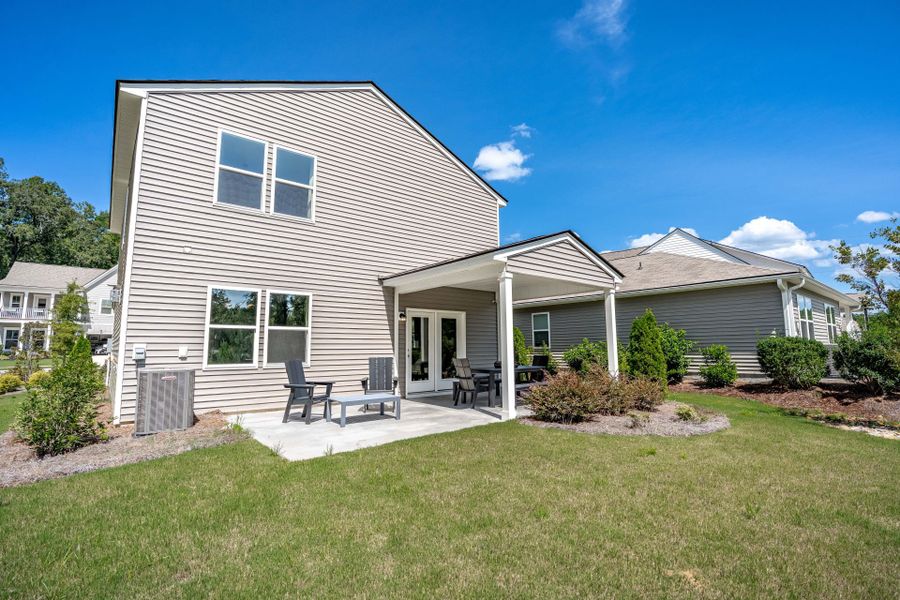 Exterior details and patio area of a home in Grand Arbor, Blythewood (Image 31).