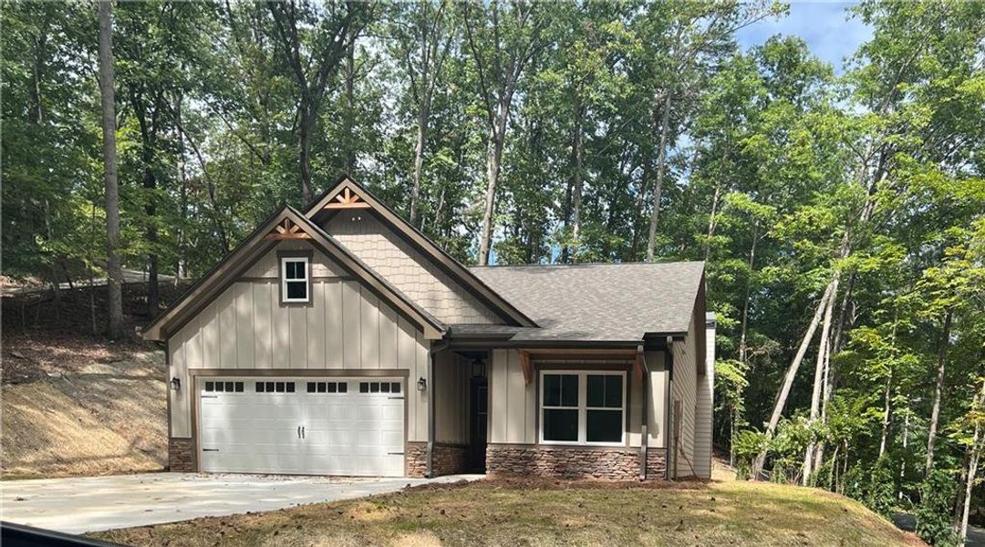 Front exterior of a new home in , Waleska, GA, highlighting curb appeal (Image 1). Front exterior of a new home in , Waleska, GA, highlighting curb appeal (Image 1).