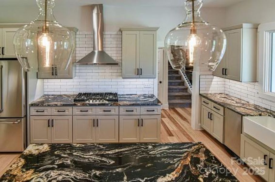 Spacious kitchen with Incredible granite counter tops. Similar photo.