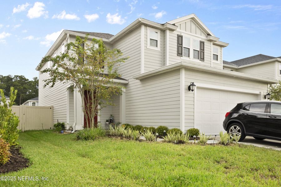 Front exterior of a new home in , St. Johns, FL, highlighting curb appeal (Image 21).