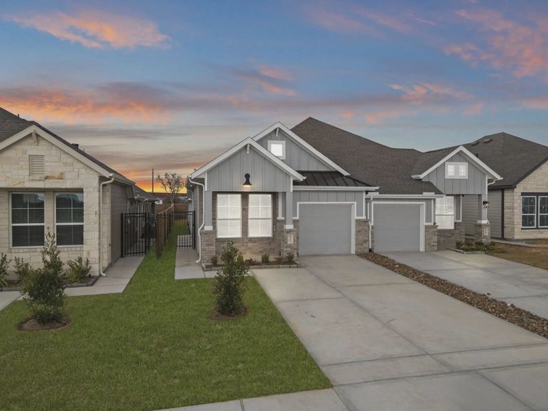 Representative exterior photo of a completed home built from the Carriagehouse by Chesmar Homes in Meridiana Townhomes, Iowa Colony, TX (Image 28).