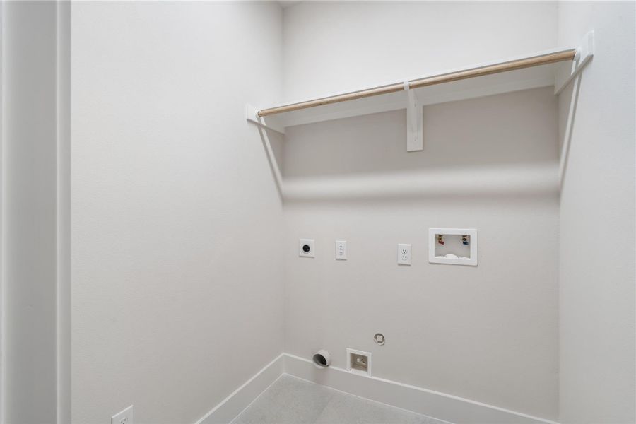 A dedicated utility room with built-in shelving. A dedicated utility room with built-in shelving.
