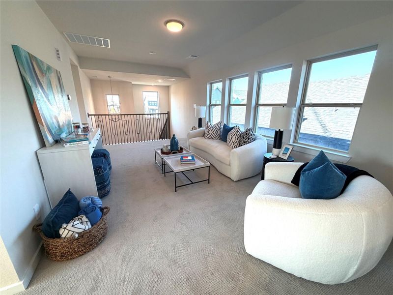 Game room upstairs overlooks family room and with light from all directions.